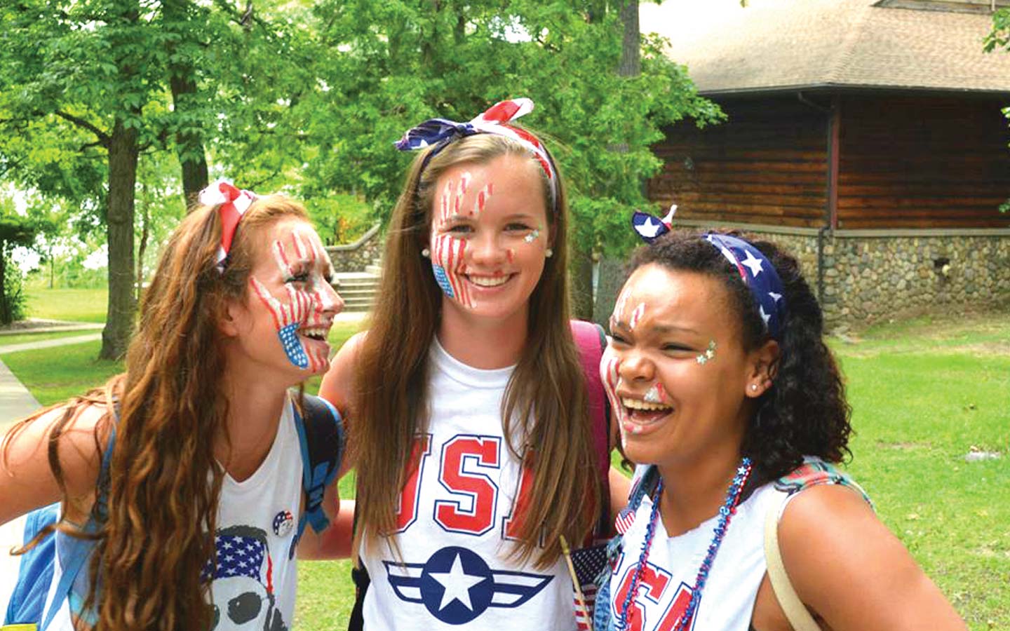 3 counsellors in American colours laughing
