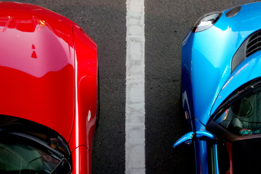 An overhead view of two cars parked side-by-side