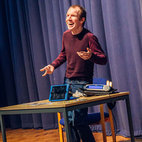 Lee Ridley AKA Lost Voice Guy giving a lecture at Marjon